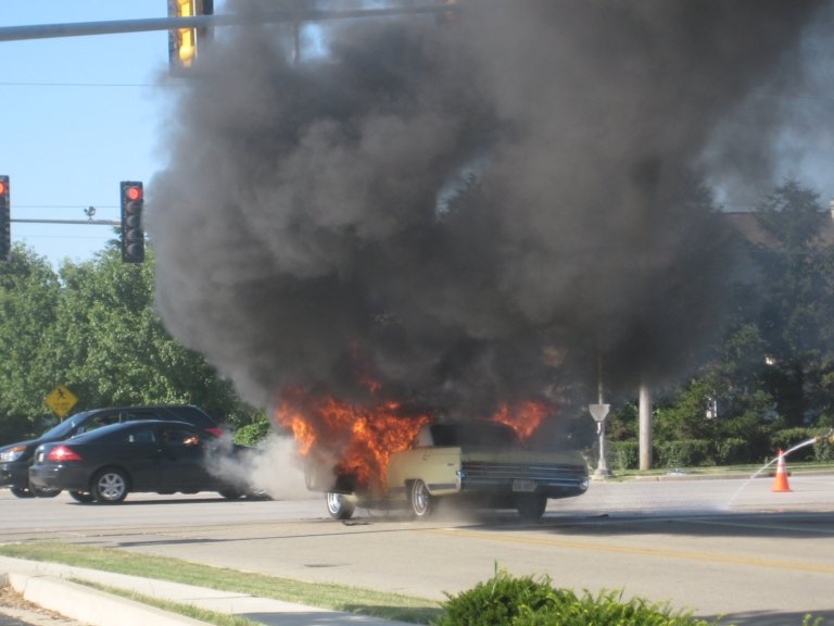 1964 Wildcat on fire in intersection